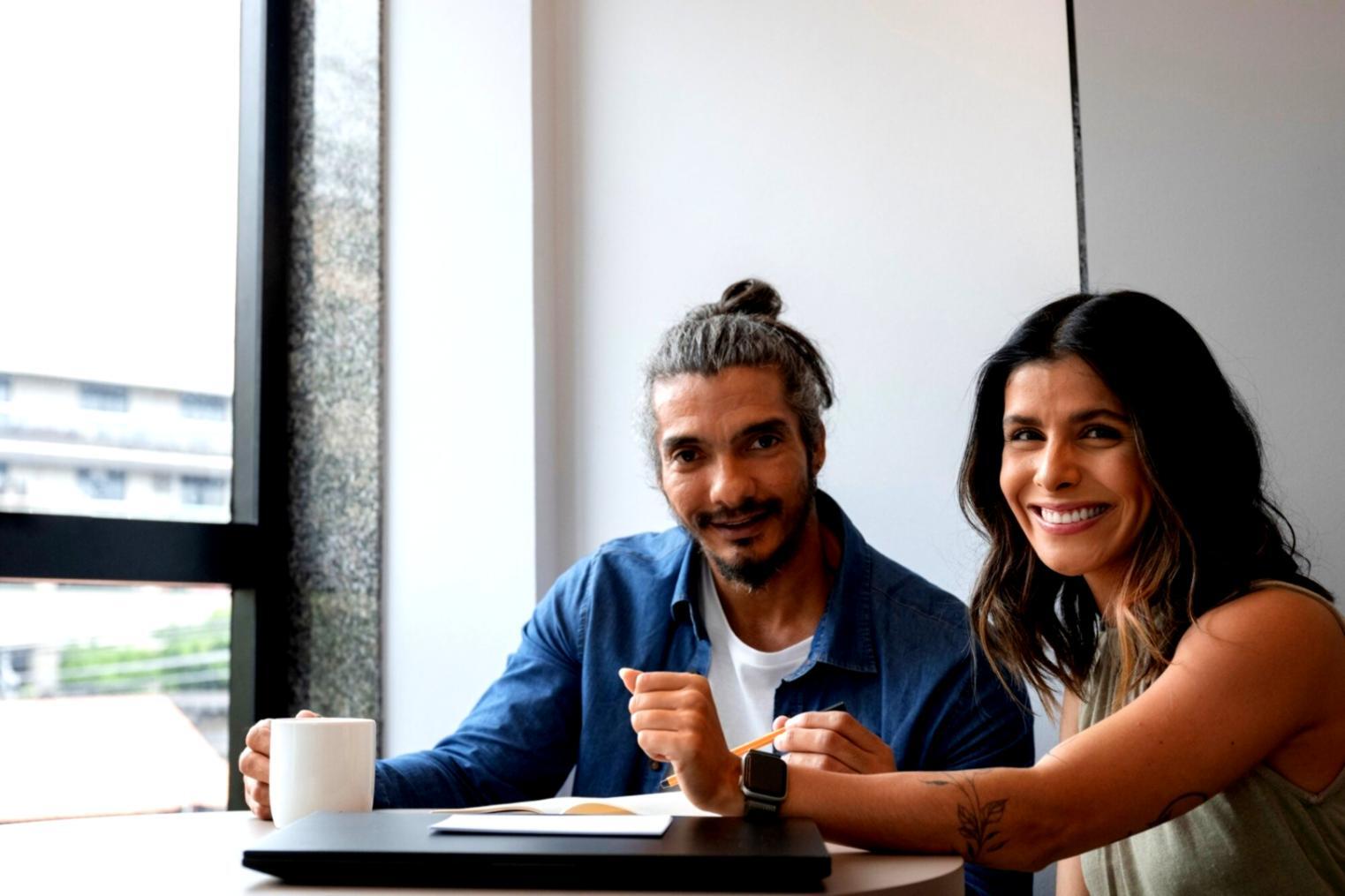 Collaborative workspace showing game development planning session with multiple screens and design documents